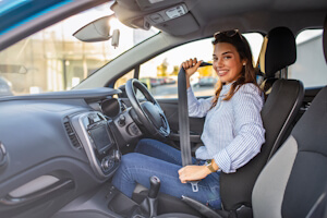 a woman in her insured car