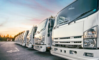 a fleet of trucks in a row